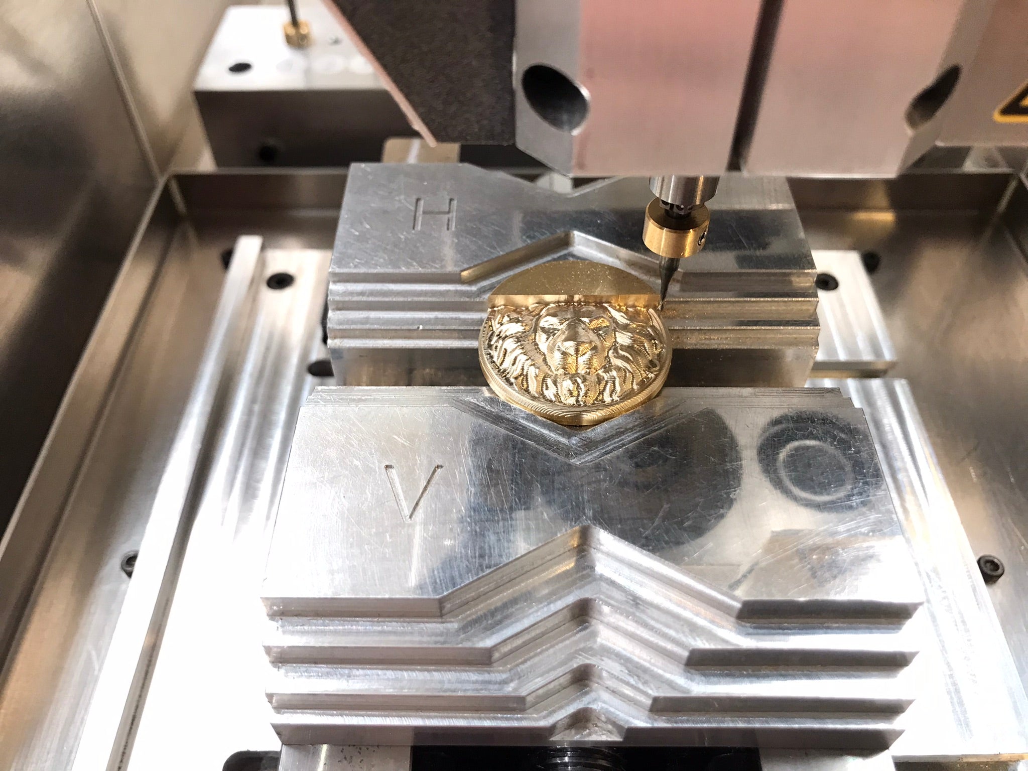 Load video: milling machine for jewelry Veromill 3D engravings and relief milling in finest quality. Here a 3D engraving of a lion head. CAM software: Fusion 360 and STL model Finest and reflective surfaces, which no longer need to be reworked!