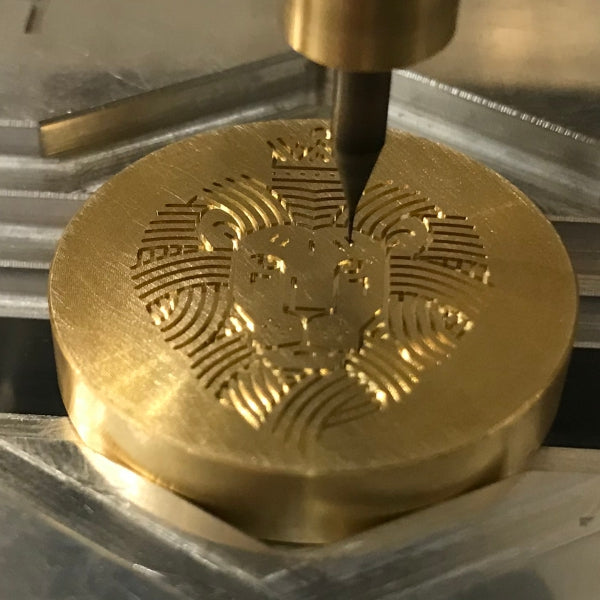 micro machining center during micro machining of an engraving: Lion's head | mini cnc mill